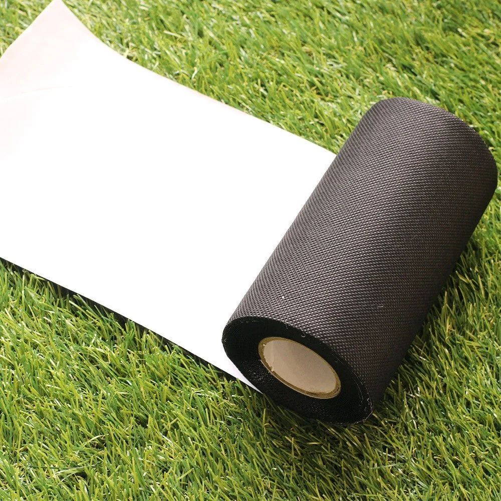 A roll of seam tape unrolled across artificial turf